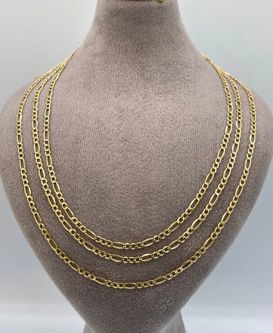 Gold chain necklaces displayed on a mannequin bust against a neutral background