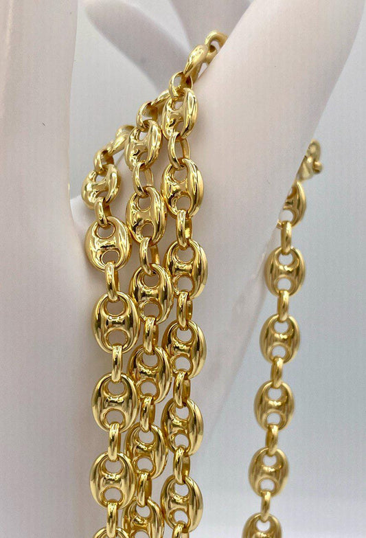 Gold chain necklace on a white background