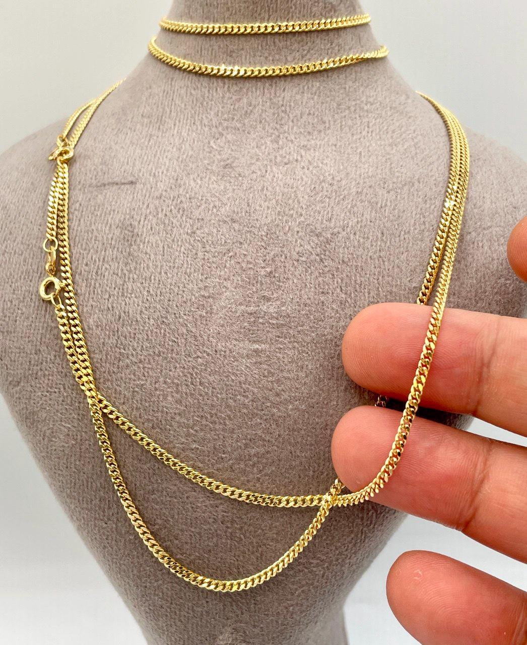 gold chain with hand