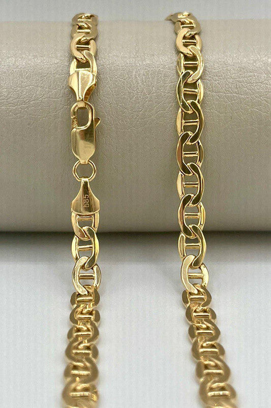 Gold chain bracelet on a white background