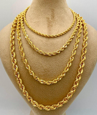 Three gold rope chains displayed on a mannequin bust.
